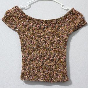 Set of two cap sleeve, patterned blouses.